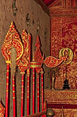 Chiang Mai - The Wat Phra Singh temple. The small Viharn Lai Kham (Gilded Hall), the interiors are  decorated with brocade-like gold and red pattern. 